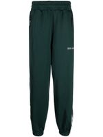 izzue pantalon de jogging à logo imprimé - Vert