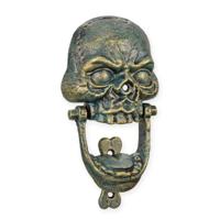 A CAST IRON SKULL DOOR KNOCKER - thumbnail