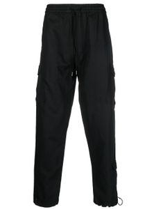 Maharishi pantalon cargo fuselé à lien de resserrage - Noir