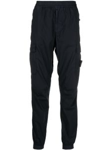 Stone Island pantalon cargo à motif Compass signature - Bleu